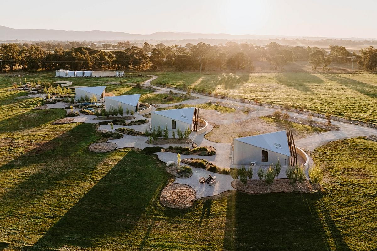 Sculptural Roofs and Rammed Earth Walls Define this Bold Design