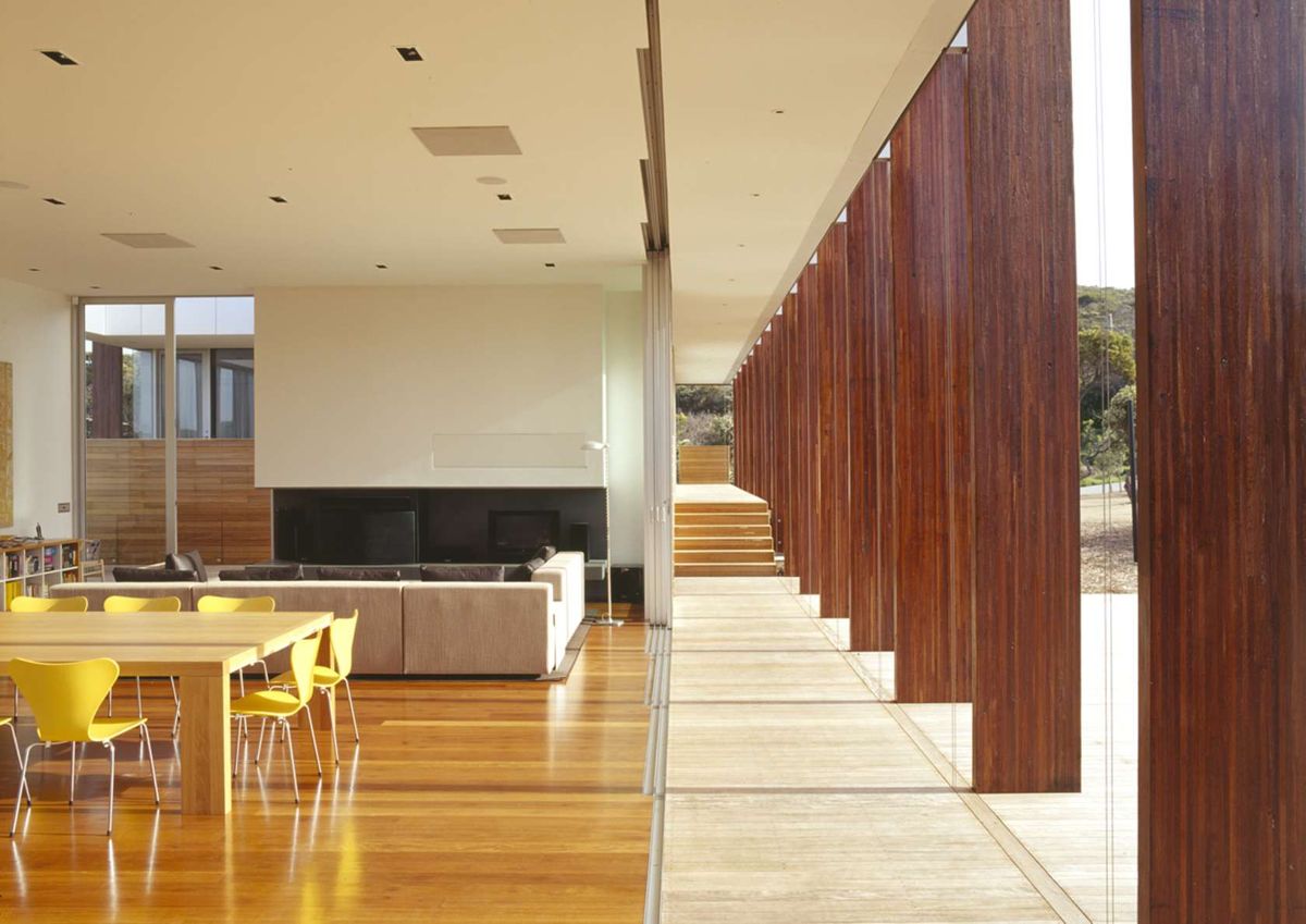 Two Living Pavilions Under One Roof Open Onto an Outdoor Covered Deck