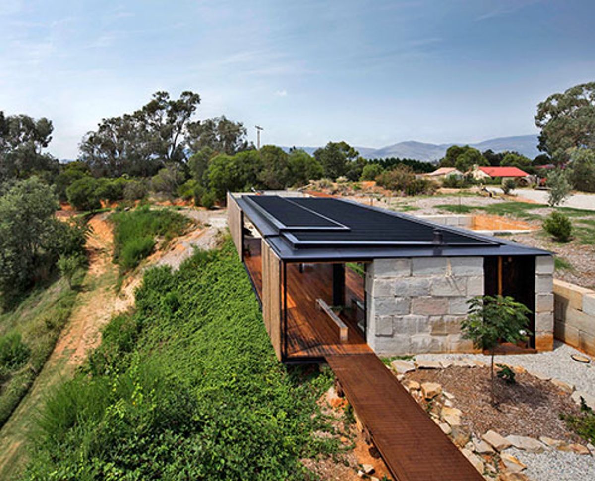 Sawmill House Rethinks Waste Materials to Create Raw, Rustic Beauty