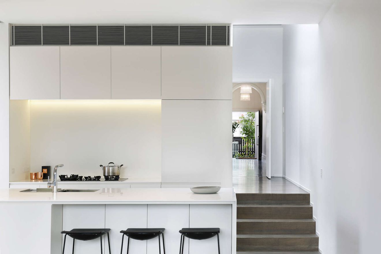 A Stunning Light-Well Separates This Addition From the Original Home