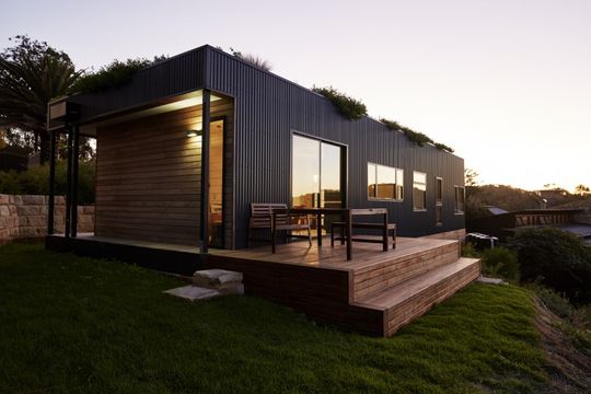 This Green Roofed Beach House Arrived on the Back of a Truck