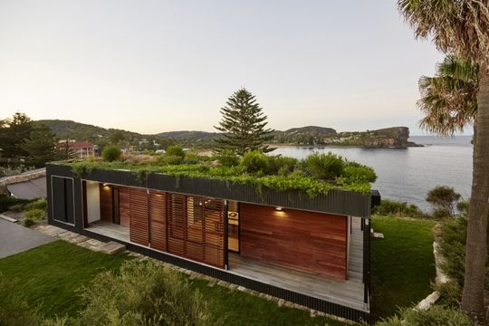 This Green Roofed Beach House Arrived on the Back of a Truck