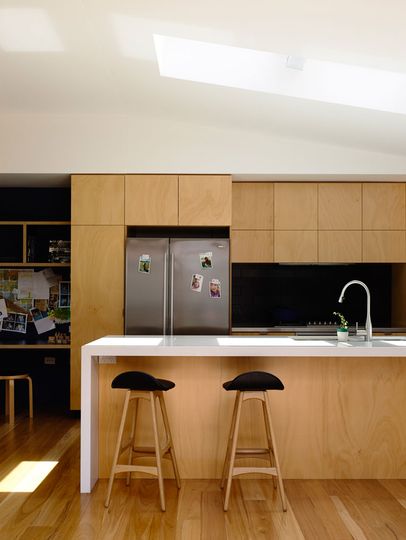 Batten and Board House Kitchen is lit by a North-facing skylight