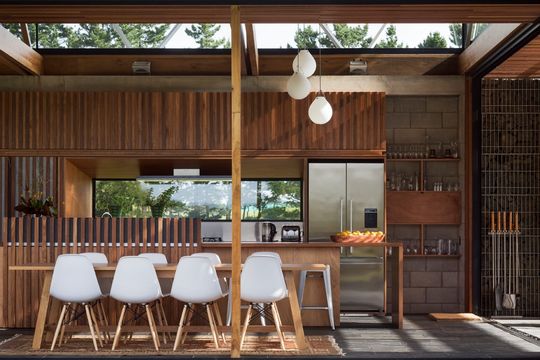 This Home Is Grounded Into Its Site by Walls of Gabion Baskets