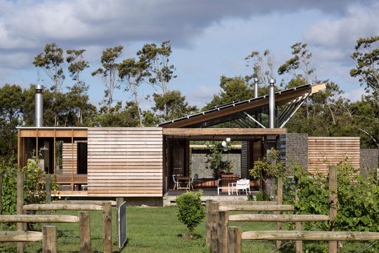 This Home Is Grounded Into Its Site by Walls of Gabion Baskets