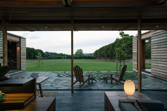 This Home Is Grounded Into Its Site by Walls of Gabion Baskets