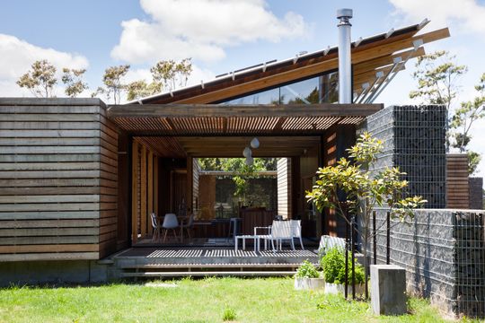 This Home Is Grounded Into Its Site by Walls of Gabion Baskets