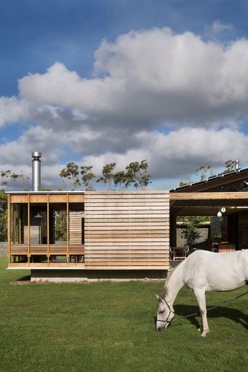 This Home Is Grounded Into Its Site by Walls of Gabion Baskets