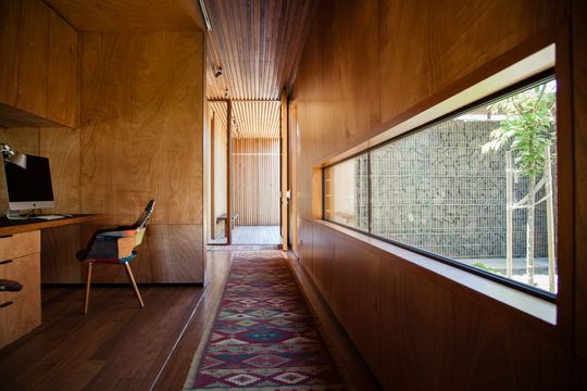 This Home Is Grounded Into Its Site by Walls of Gabion Baskets