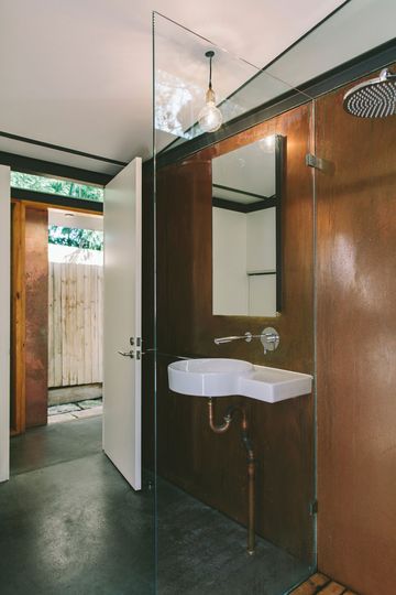 Copper House Takt Studio for Architecture the use of copper is continued in the bathroom including exposed pipework