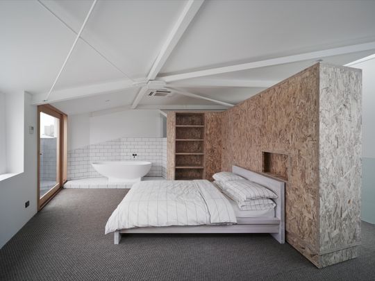 In the bedroom a large wardrobe can pivot out of the way to create a second bedroom or study area to make the most of Cubby House's small space