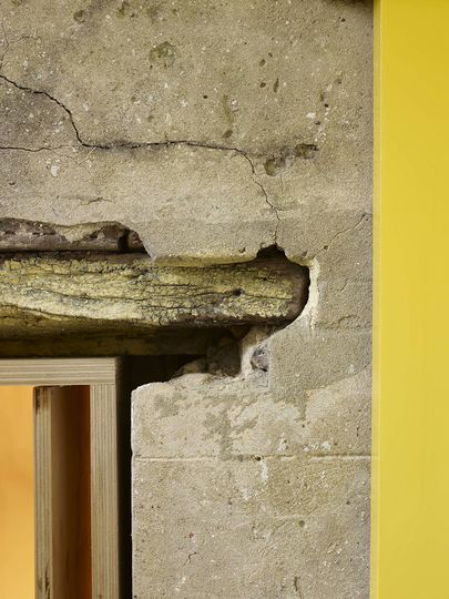 An old timber lintel against original render is left intact and the existing open is lined with a new plywood dressing at Fitzroy Terrace in Sydney