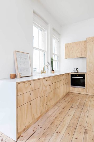 Flinders Lane Space Efficient Apartment plywood kitchen
