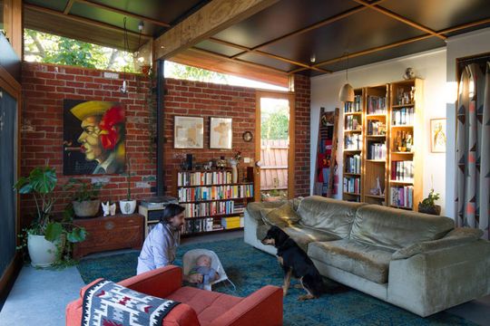 In the living area of Florence Street House you can see the exposed brick walls, exposed rafters and exposed concrete floor