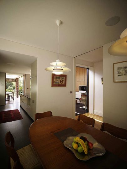 Haberfield House dining room opens into the kitchen and living area