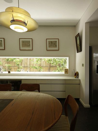 Haberfield House dining room has a narrow window and storage unit