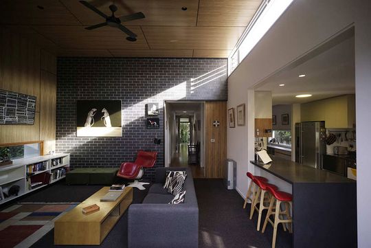 Light streams through the clerestory window into the living area of Haberfield House