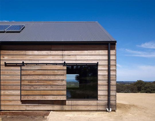 Hill Plain House has sliding shutters that can be pulled across windows for shading or protection