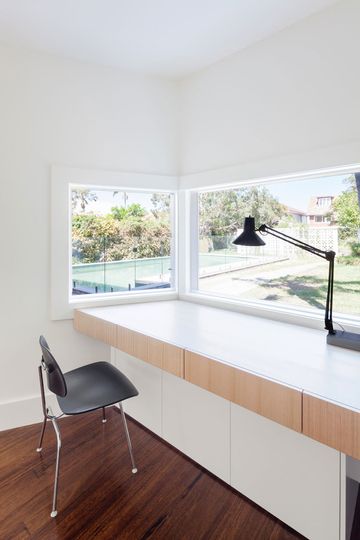 A built in desk in House Chapple's studio overlooks the garden and pool