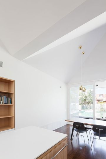 The ceiling folds and bends overhead to define the various spaces in the open plan living area