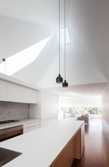 House Chapple's north facing skylight over the kitchen lets the sun in, which is then bounced around the pyramid-shaped ceiling