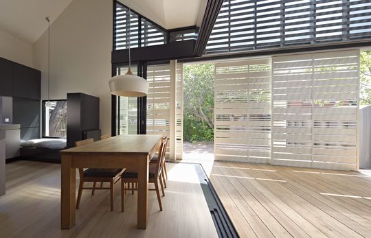 House Reduction has a sliding timber screen to moderate the amount of sunlight and privacy