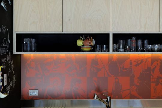 Islington House kitchen features a custom printed splash back to show off the owners' passion for music