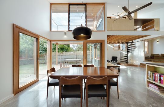 A Cozy, Nest-Like Mezzanine Studio Floats Above This Living Space