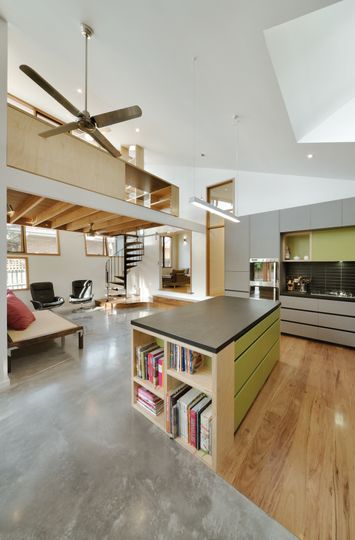 A Cozy, Nest-Like Mezzanine Studio Floats Above This Living Space