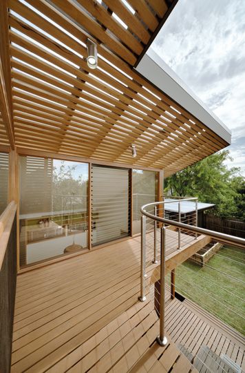 A Cozy, Nest-Like Mezzanine Studio Floats Above This Living Space