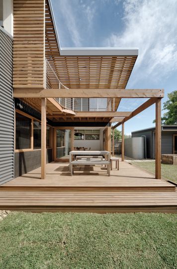 A Cozy, Nest-Like Mezzanine Studio Floats Above This Living Space