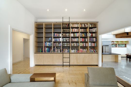 A Cozy, Nest-Like Mezzanine Studio Floats Above This Living Space