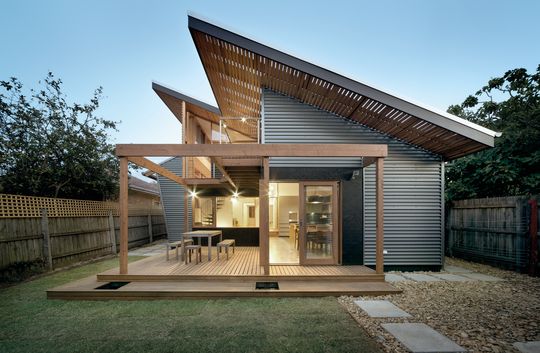 A Cozy, Nest-Like Mezzanine Studio Floats Above This Living Space