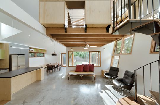 A Cozy, Nest-Like Mezzanine Studio Floats Above This Living Space