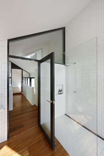 North Fitzroy House's ensuite bathroom is stunning in black and white with an unusual tile pattern