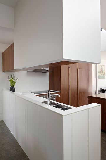 North Fitzroy House kitchen uses timber veneer and a textured white panel to look simple but not boring
