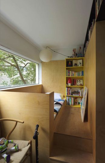 Potts Point Apartment child's bedroom is raised on a platform to make space for the adult's pull out bed