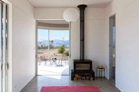The Southern Highlands House has a small, efficient fireplace to keep the house warm in winter and louvre windows for ventilation and cooling in summer