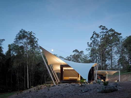 A Unique Family Home Covered Entirely By a Tent Structure