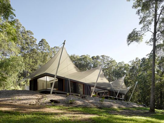 A Unique Family Home Covered Entirely By a Tent Structure