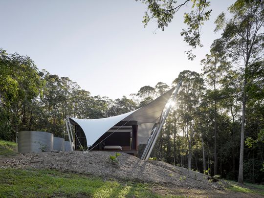 A Unique Family Home Covered Entirely By a Tent Structure