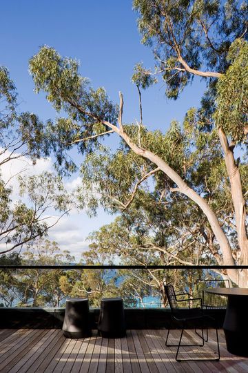 One of Treehouse's outdoor living areas overlooks the ocean and eucalyptus trees