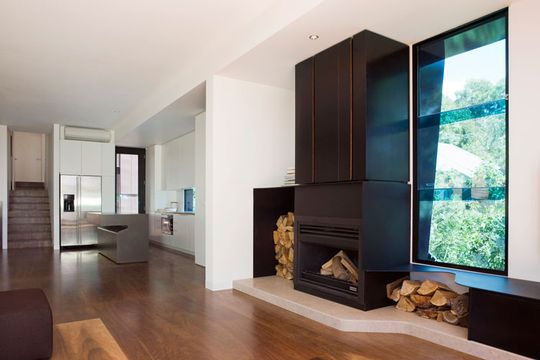 A wood fireplace is the heart of one of Treehouse's living areas