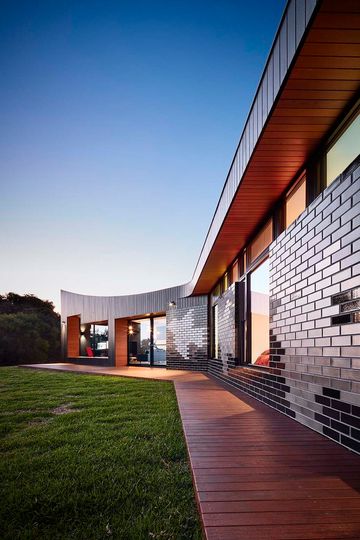 The Glazed Brick Facade at This Beach House is Inspired By Escher
