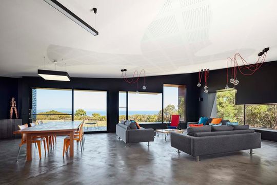 The Glazed Brick Facade at This Beach House is Inspired By Escher