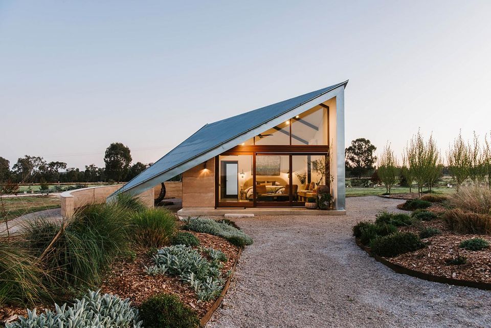 Sculptural Roofs and Rammed Earth Walls Define this Bold Design